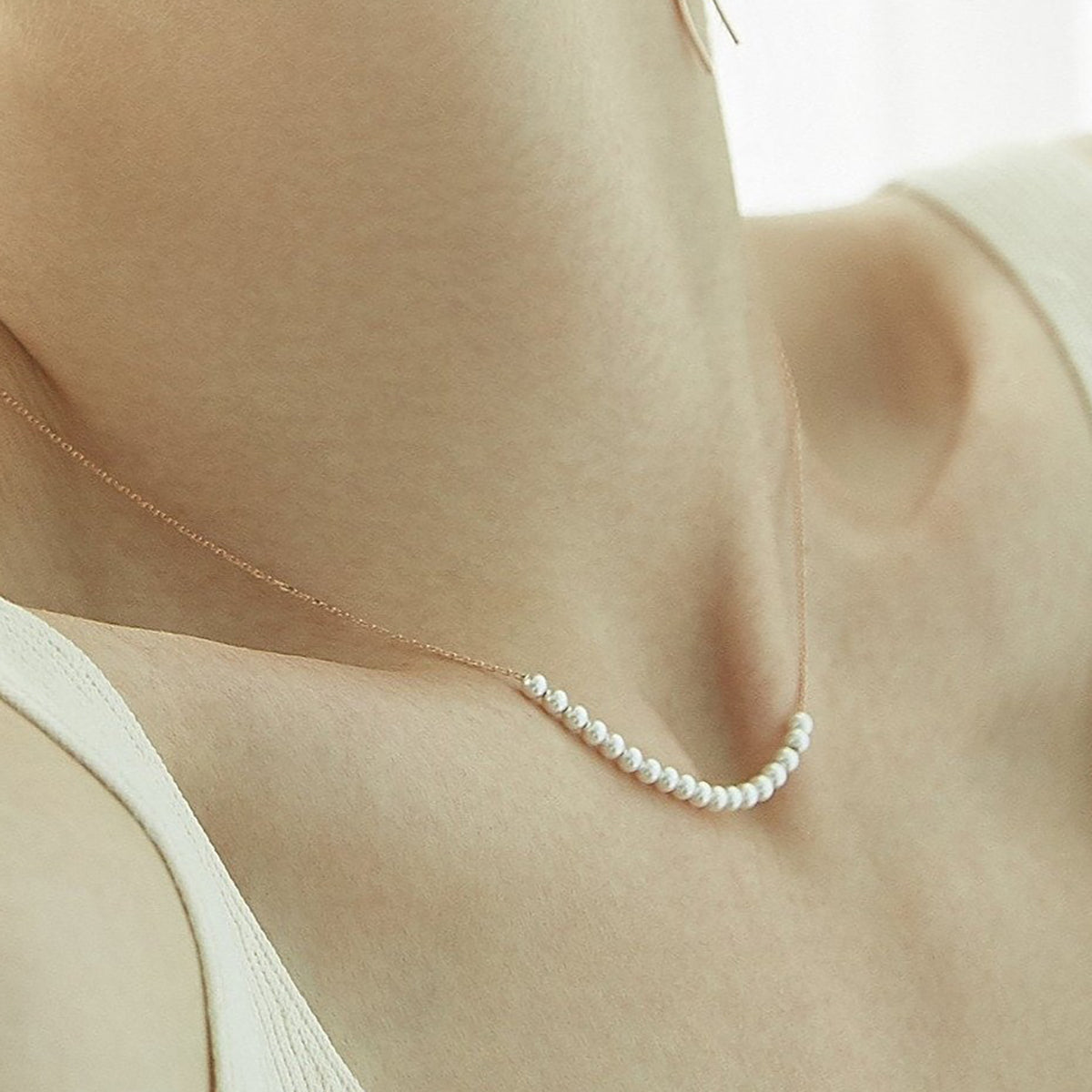 The Relay Pearl Arc Necklace