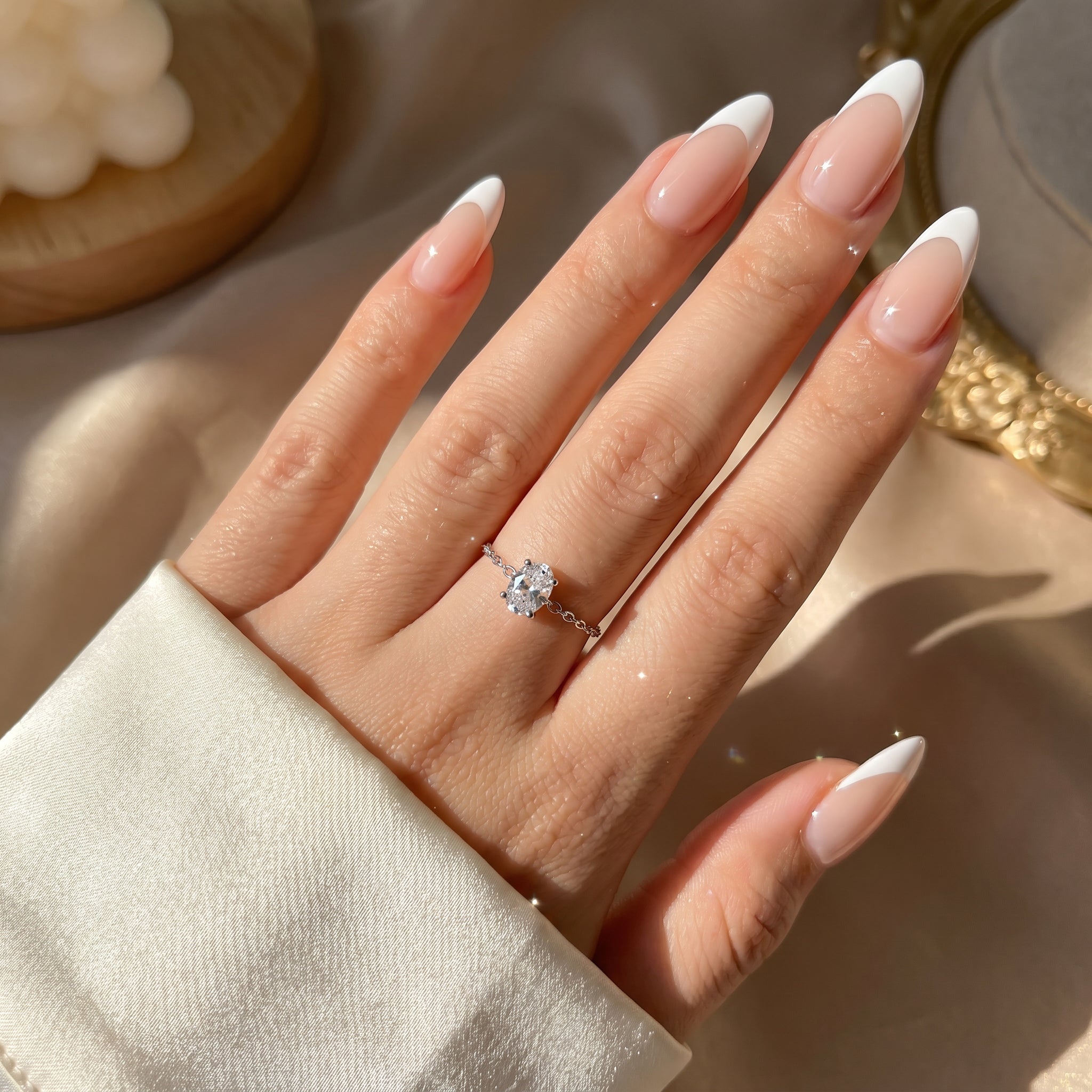 LAURRÈ gold adjustable chain ring worn on hand